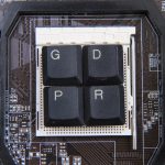 G, D, P, R, keys from keyboard sitting on top of CPU.