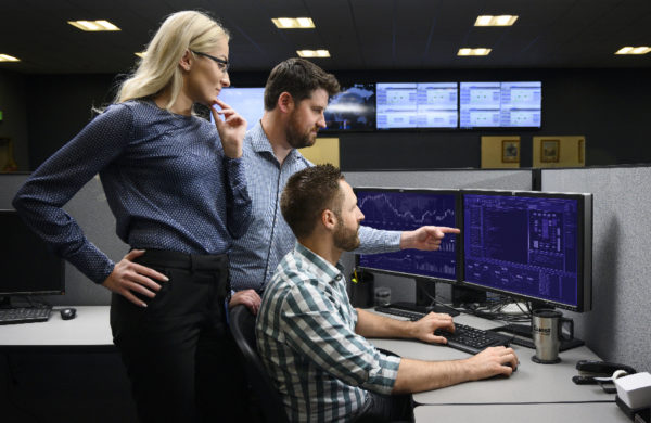 Quest Managed Services reading computer monitor