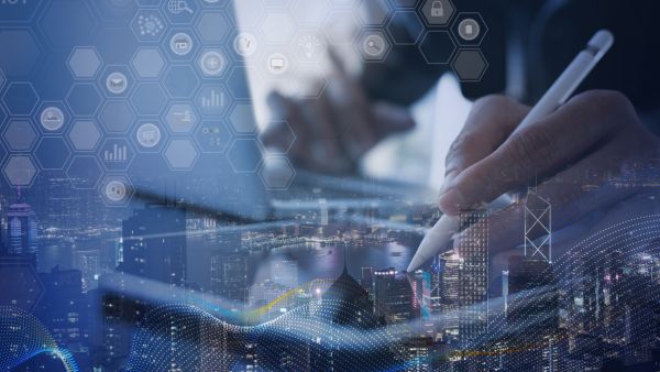 Technology professional working with a digital interface overlaid on a cityscape, representing application performance testing, software scalability, system responsiveness, and identifying performance bottlenecks before production