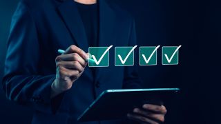 Business professional conducting a vendor risk assessment using a digital checklist to evaluate third-party risks and vendor security.